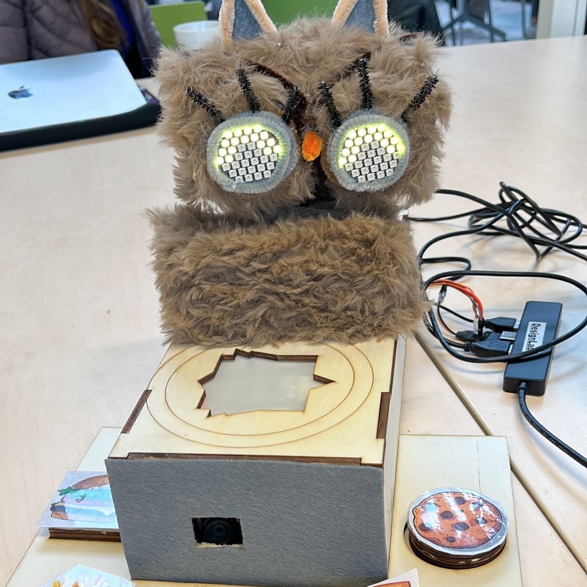 Owlie plush robot prototype with large illuminated eyes